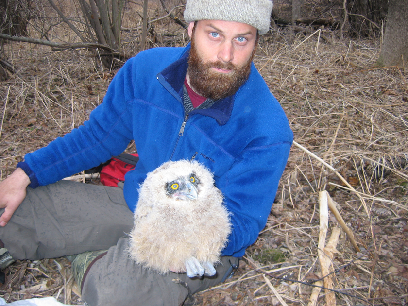 Jonathan Slaght, one of the study’s co-authors, holding an owl chick. Photo: Sergei Surmach.